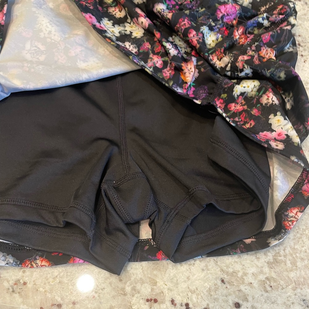 Multi colored pinks/ black tennis skirt from Fila